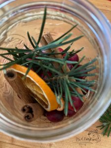 Dry Orange Slices with other ingredients in jars